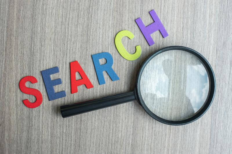 Search Engine Optimization with a magnifying glass
